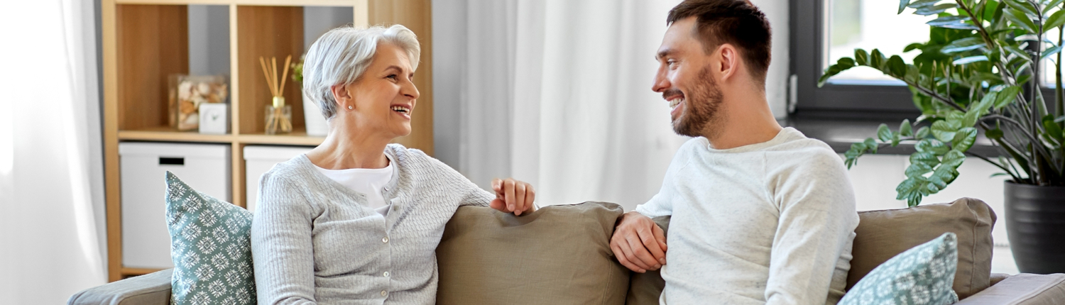 A young man teaching an older adult about the benefits of respite care