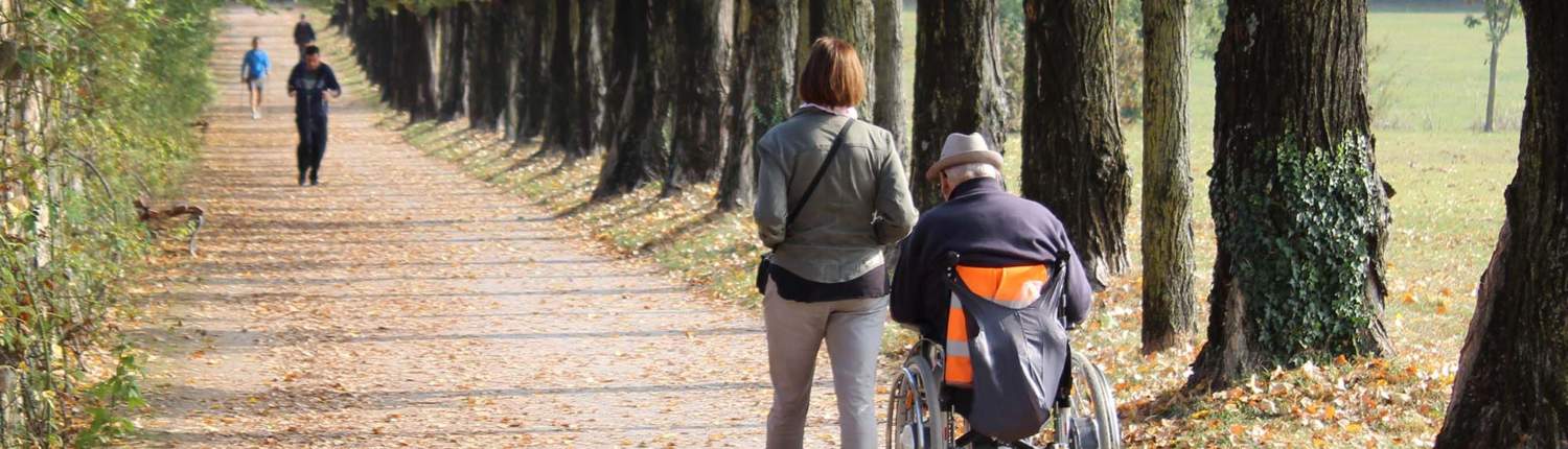 Caregiver on a walk in a park