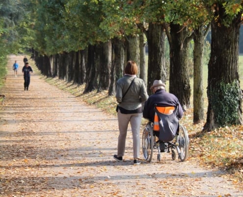 Caregiver on a walk in a park